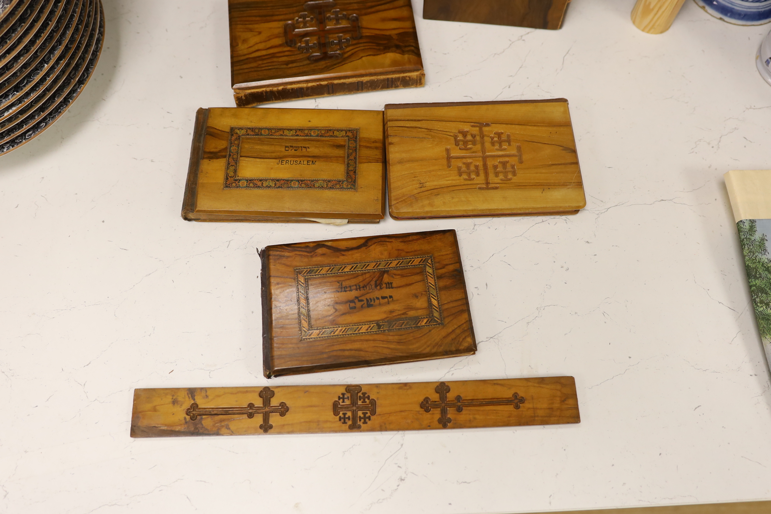 A collection of Jerusalem ware olive wood boxes, two albums, two books, etc.